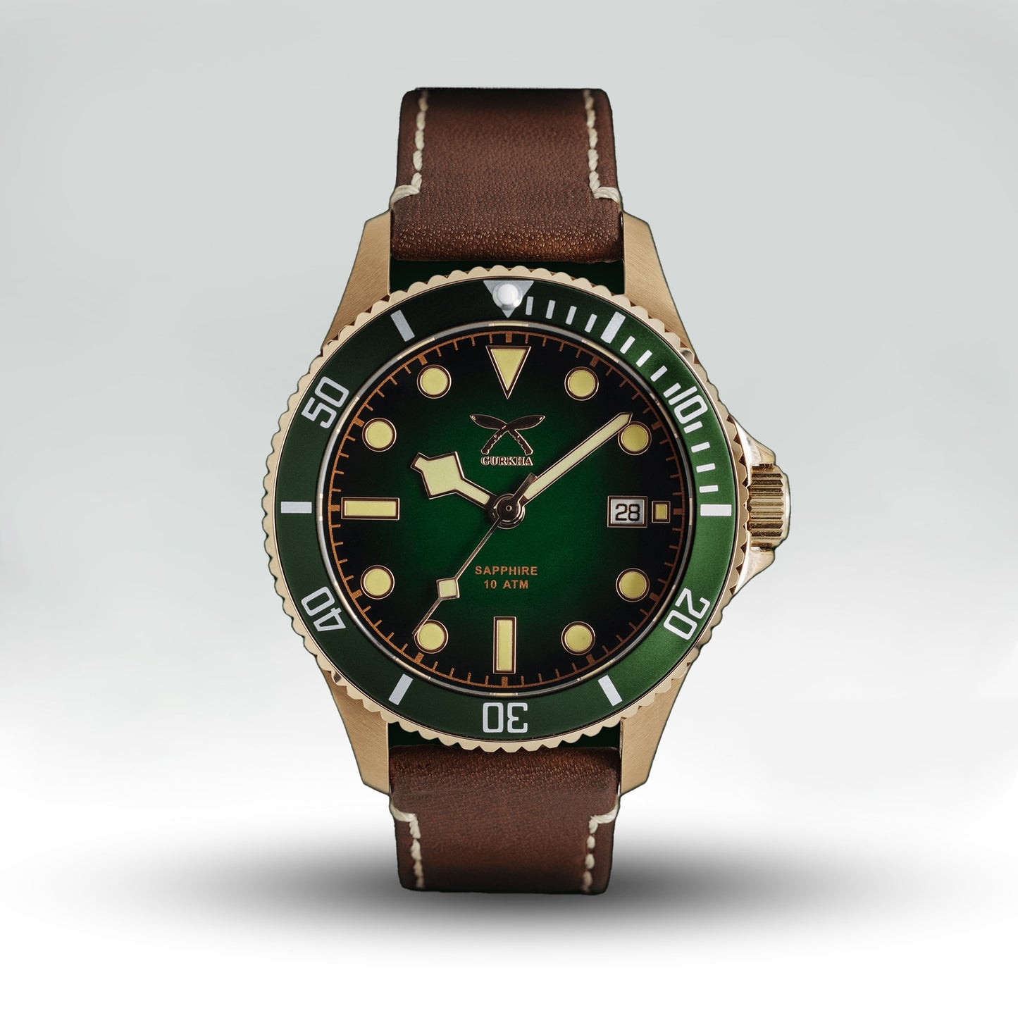 Green dial watch with brown leather strap