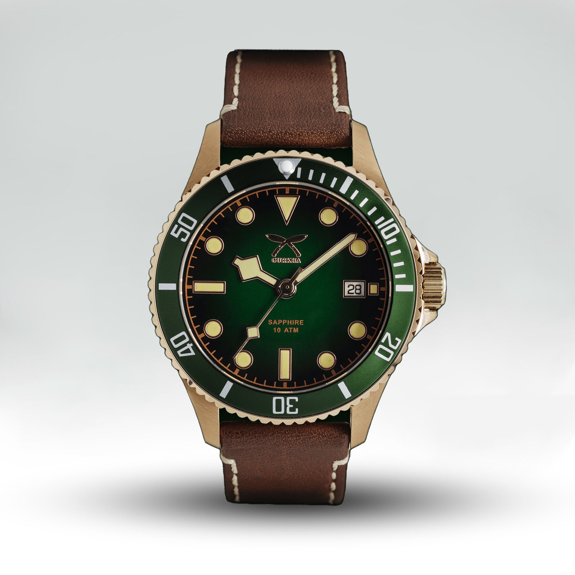 Green dial watch with brown leather strap