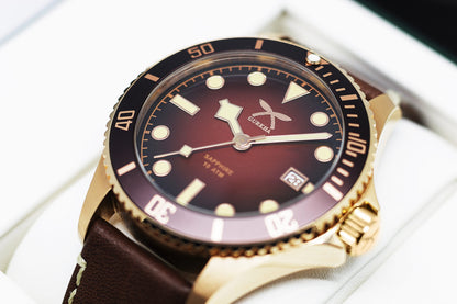 Bronze wristwatch with brown leather strap and bezel
