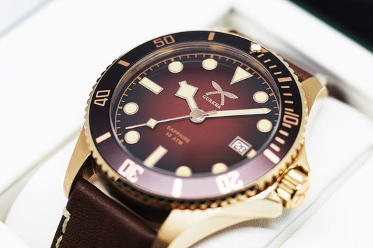 Bronze wristwatch with brown leather strap and bezel